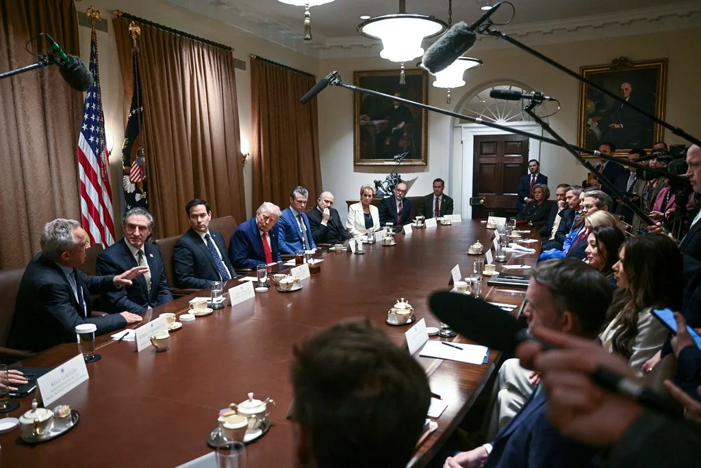 Health and Human Services Secretary Robert F. Kennedy Jr., from left, speaks as Interior Secretary Doug Burgum, Secretary of State Marco Rubio, President Donald Trump, Defense Secretary Pete Hegseth, Commerce Secretary Howard Lutnick Secretary of Education Linda McMahon, Director of the Office of Management and Budget Russell Vought and White House National Security Adviser Mike Waltz listen during a cabinet meeting in the Cabinet Room of the White House, Thursday, April 10, 2025, in Washington. (Pool via AP)
