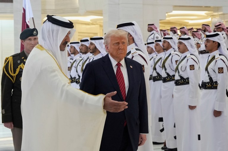 Qatar's Emir Sheikh Tamim bin Hamad Al Thani welcomes President Donald Trump during an official welcoming ceremony at the Amiri Diwan in Doha, Qatar, Wednesday, May 14, 2025.