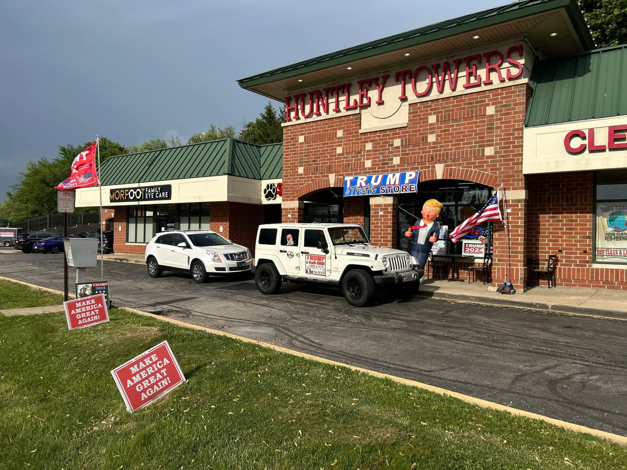 Make America Great Again signs are displayed outside the Trump Truth Store at Huntley Towers. (Courtesy of Lisa Fleischmann)