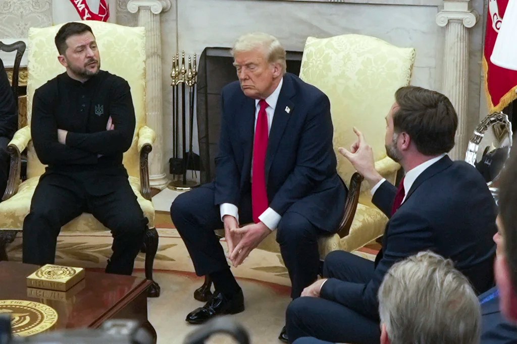 FILE - Vice President JD Vance, right, speaks with Ukrainian President Volodymyr Zelenskyy, left, as President Donald Trump listens, in the Oval Office at the White House, Feb. 28, 2025, in Washington. (AP Photo/ Mystyslav Chernov, File)