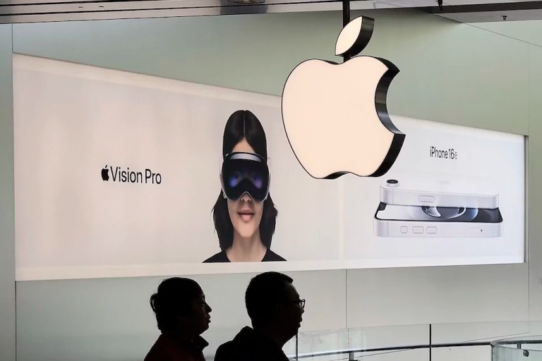 People visit an Apple Store inside a shopping mall in Beijing, Thursday, April 10, 2025.