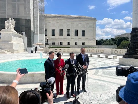 Four attorneys general from Democratic states speak to reporters outside the Supreme Court, May 15, 2025, in Washington.