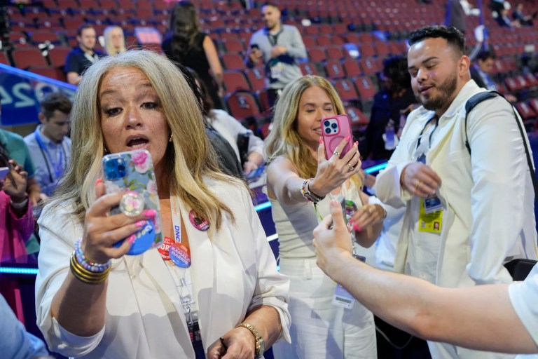 Content creators Kerry Robertson, from left, Sari Beth Rosenberg and Juan Acosta Macias are pictured during the Democratic National Convention at the United Center in Chicago, Thursday, Aug. 22, 2024.