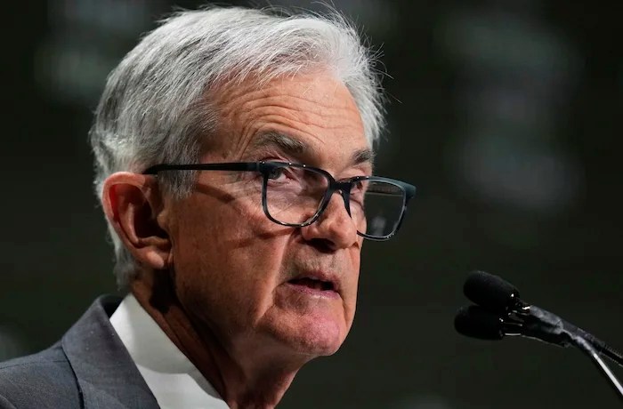 Fed holds interest rates steady in face of pressure from Trump and tariffs