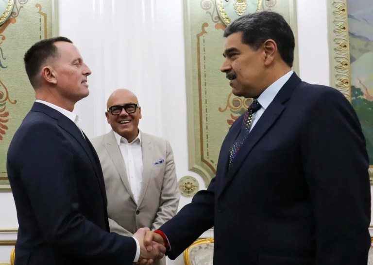 This photo released by Venezuela's presidential press office shows Venezuelan President Nicolas Maduro, right, shaking hands with Richard Grenell, President Donald Trump's special envoy, at Miraflores presidential palace in Caracas, Venezuela, Friday, Jan. 31, 2025. Behind is Jorge Rodriguez, president of the National Assembly. (Venezuela's presidential press office, via AP)
