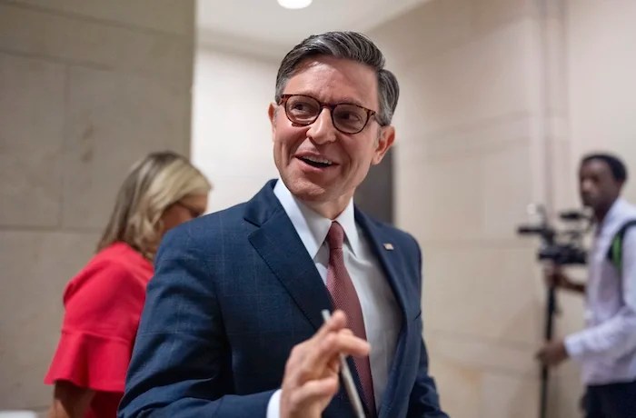 Speaker of the House Mike Johnson (R-LA) smiles as he arrives for a news conference at the Capitol in Washington, Wednesday, June 12, 2024.