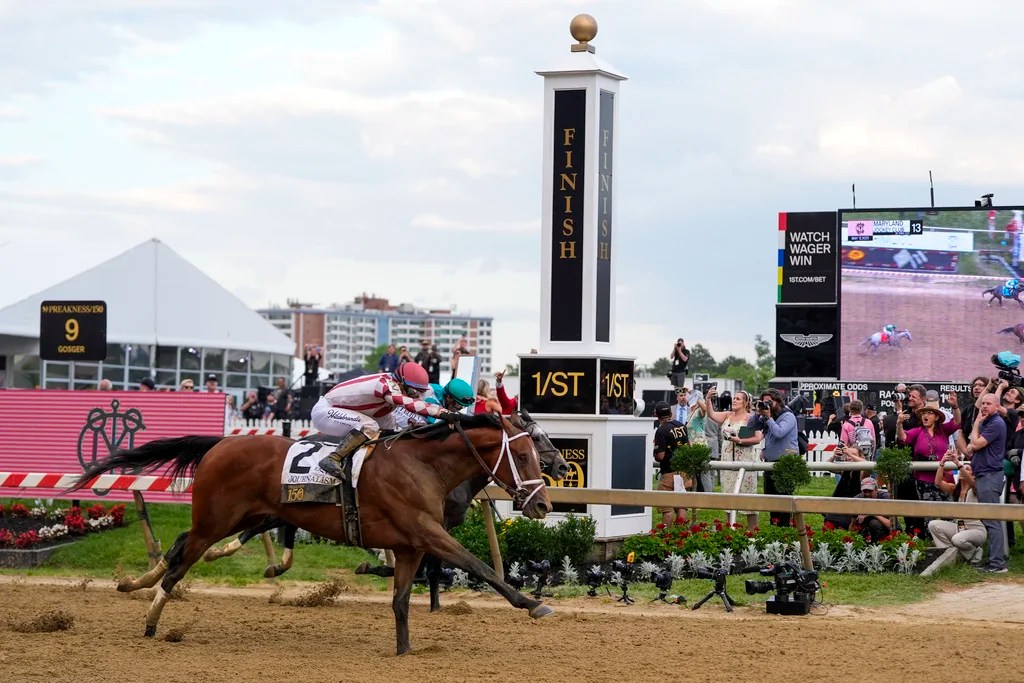 Umberto Rispoli, atop Journalism, left, edges out Luis Saez, atop Gosger, to win the 150th running of the Preakness Stakes horse race Saturday, May 17, 2025, at Pimlico Race Course in Baltimore. 