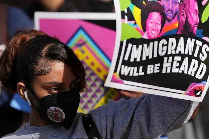 Immigrant rights supporters demonstrate during a May Day rally outside the federal courthouse in Philadelphia, Thursday, May 1, 2025. (AP Photo/Matt Rourke)