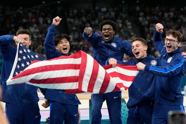 Team USA from left to right Brody Malone, Asher Hong, Fred Richard, Paul Juda and Stephen Nedoroscik celebrate their bronze medal during the men's artistic gymnastics team finals round at Bercy Arena at the 2024 Summer Olympics, July 29, 2024, in Paris, France.