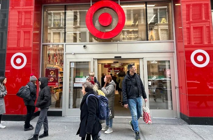 Shoppers walk from a Target store in midtown Manhattan in New York on Tuesday, March 19, 2024.