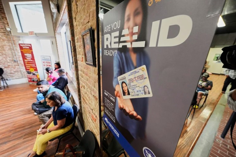 People wait inside a branch of the Louisiana Office of Motor Vehicles in Kenner, Tuesday, May 6, 2025.