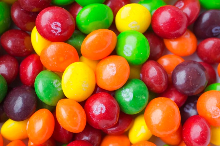 Photo shows Skittles, in New York. The Associated Press takes a look at how candy, cookie and soda makers are shaping nutrition science. Critics say industry-funded research is marketing masquerading as science, but the findings nevertheless become a part of the scientific literature.)