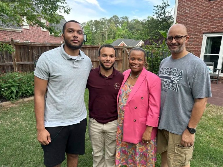 Michelle and Richard Beck, right, stand outside their Atlanta-area home Thursday, May 1, 2025. They are Gen Xers who speak with southern accents while their Gen Z sons, Dylan and Richard, left, do not.