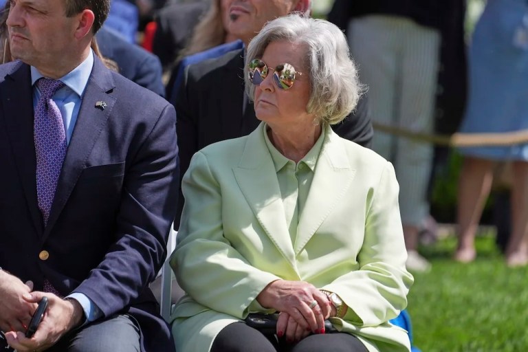 White House Chief of Staff Susie Wiles sits as President Donald Trump arrives to speak during a bill signing event for the 