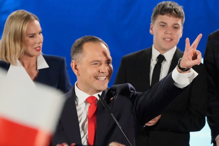 Presidential candidate Karol Nawrocki, a conservative historian backed by the right-wing Law and Justice party greets supporters as he arrives at his headquarters after the presidential election runoff in Warsaw, Poland, Sunday, June 1, 2025.