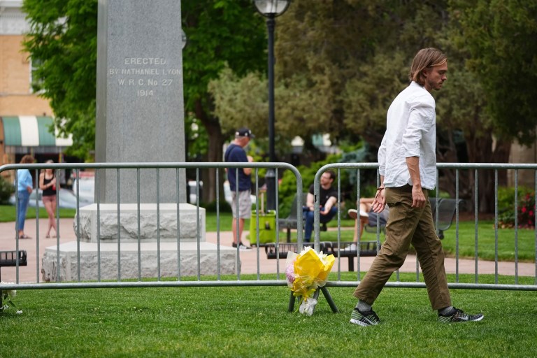 Flowers are placed along a makeshift barrier outside of the Boulder County, Colorado, courthouse after Sunday's attack Monday, June 2, 2025.