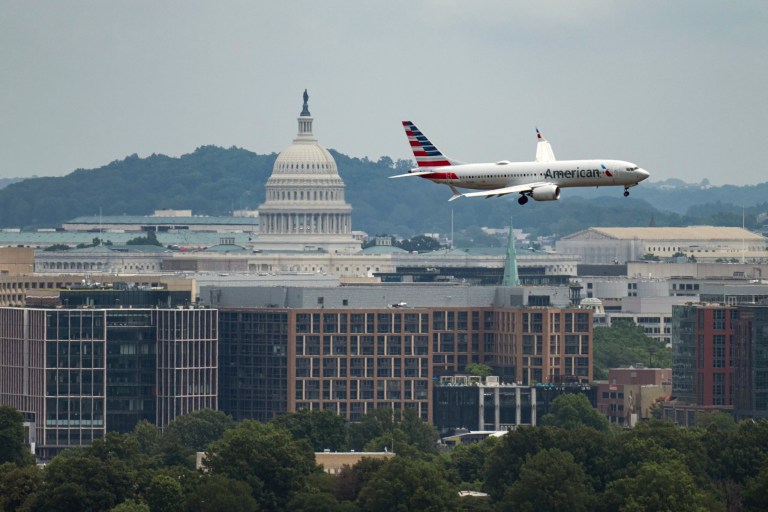 UNITED STATES - JUNE 14: An American Airlines jet comes in for a landing at Ronald Reagan Washington National Airport on Saturday, June 14, 2025, before the start of President Donald Trump's military parade in Washington. The FAA has ordered a pause of all arrivals and departures to and from the airport during the parade. (Bill Clark/CQ Roll Call via AP Images)