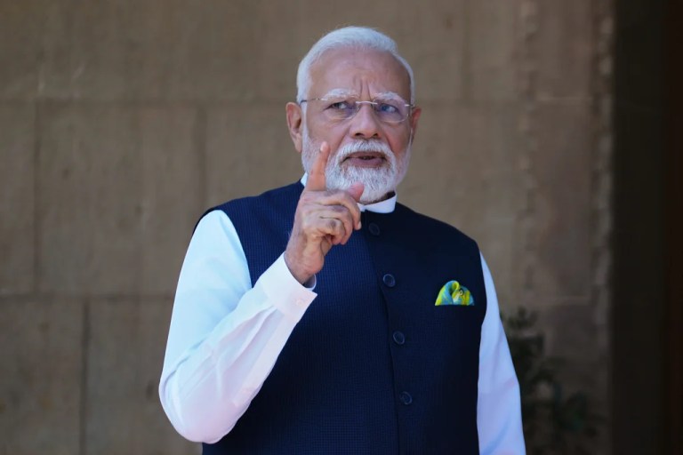 Indian Prime Minister Narendra Modi gestures as he talks with Cyprus President Nikos Christodoulides.