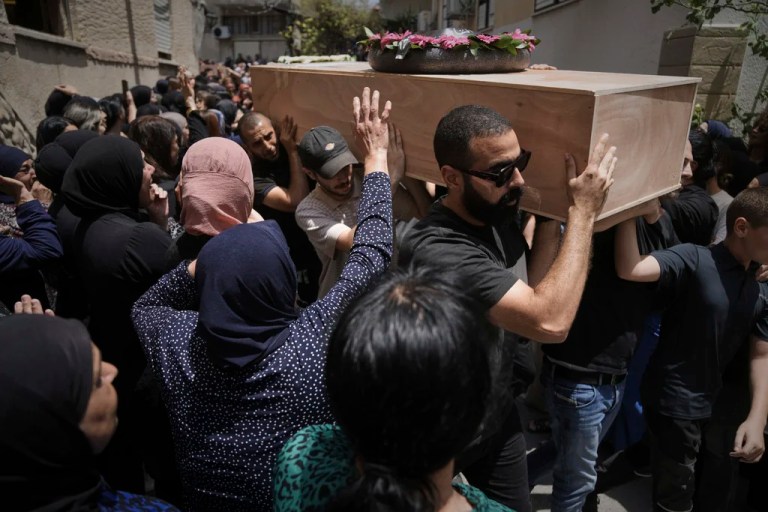 Mourners carry the caskets of four members of the Khatib family, Palestinian citizens of Israel killed in an Iranian missile strike on Tamra, Israel, during their funeral, on Tuesday, June 17, 2025