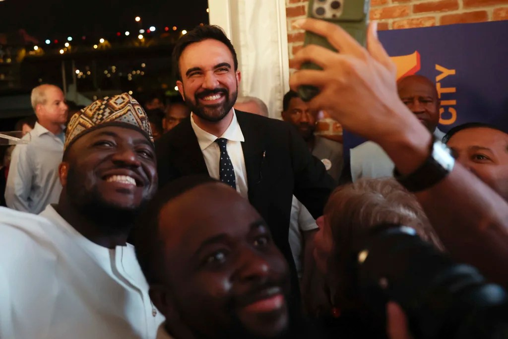 Democratic mayoral candidate Zohran Mamdani takes selfies with supporters after speaking at his primary election party, Wednesday, June 25, 2025, in New York. (AP Photo/Heather Khalifa)