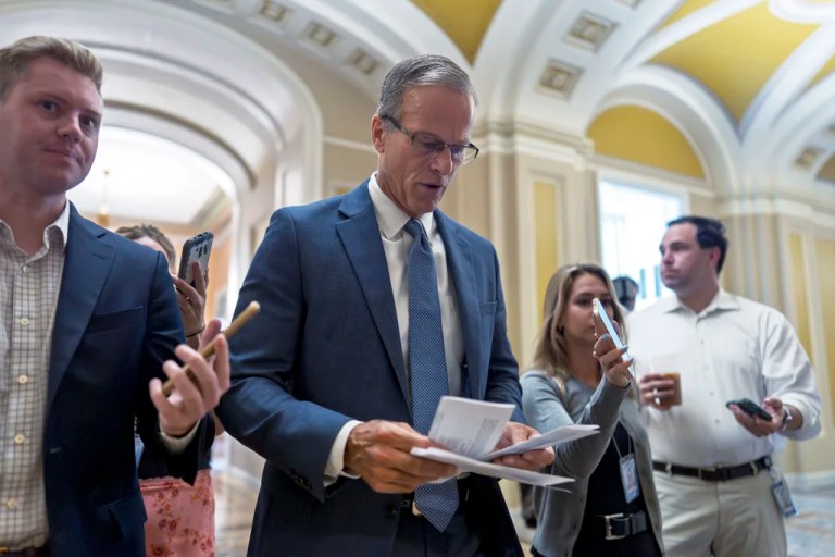 Senate Majority Leader John Thune (R-SD) checks his notes before entering the chamber as Republicans begin a final push to advance President Donald Trump's tax breaks and spending cuts package, at the Capitol in Washington, Monday, June 30, 2025.