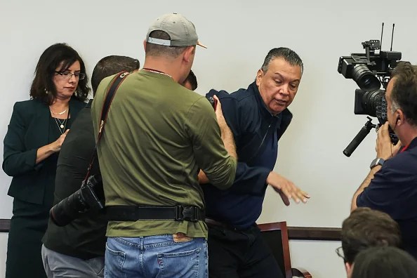 US Senator Alex Padilla, Democrat from California, is removed from the room after interrupting a news conference with Department of Homeland Security Secretary Kristi Noem at the Wilshire Federal Building in Los Angeles on June 12, 2025. US President Donald Trump said Thursday that Los Angeles was "safe and sound" for the past two nights, crediting his deployment of thousands of troops to quell anti-deportation protests, as California prepared for a legal showdown over his unprecedented move. With protests spreading across the United States, a night-time curfew has been in place in its second-largest city with authorities tackling vandalism and looting that scarred a few city blocks. (Photo by Patrick T. Fallon / AFP) / ALTERNATE CROP