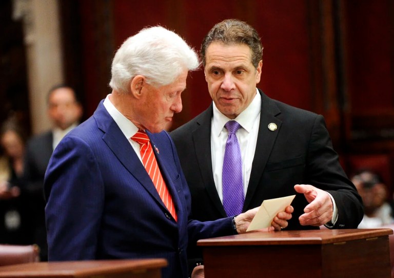 Former President Bill Clinton, left, and New York Gov. Andrew Cuomo, of New York state's Electoral College cast their ballots for Hillary Clinton in the Senate chambers of the Capitol in Albany, N.Y., Monday, Dec. 19, 2016.