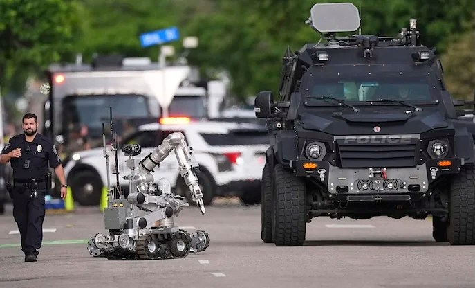 Law enforcement officials investigate after an attack on the Pearl Street Mall Sunday, June 1, 2025, in Boulder, Colo.