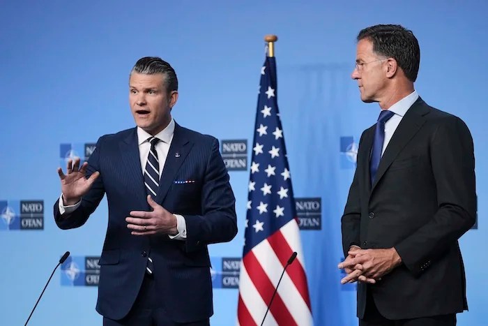 Defense Secretary Pete Hegseth, left, and NATO Secretary General Mark Rutte deliver statements ahead of a meeting of NATO defense ministers at NATO headquarters in Brussels, Thursday, June 5, 2025. 