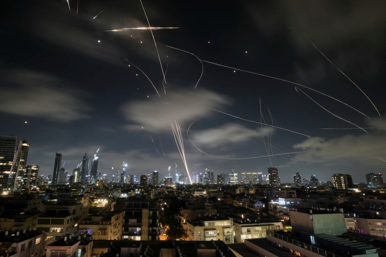 The Israeli Iron Dome air defense system fires to intercept missiles during an Iranian attack over Tel Aviv, Israel, early Wednesday, June 18, 2025.