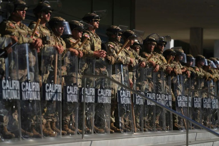 California National Guard members are positioned at the Federal Building on Tuesday, June 10, 2025, in downtown Los Angeles.