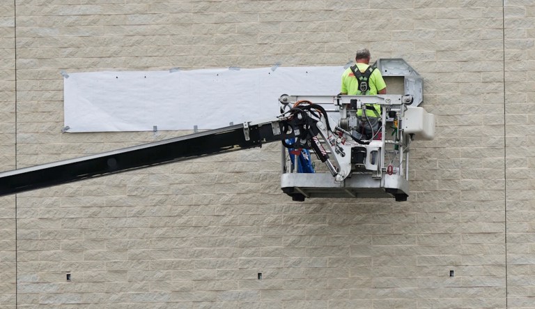 A construction worker works outside of commercial building site during a hot weather in Arlington Heights, Ill., Thursday, May 15, 2025. (AP Photo/Nam Y. Huh)