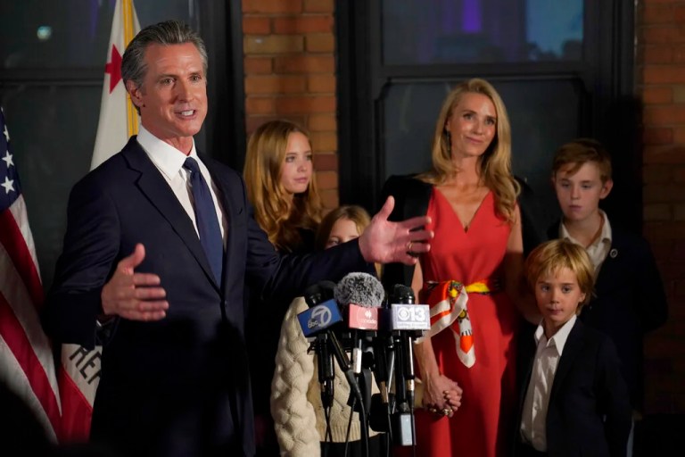 California Gov. Gavin Newsom speaks after winning his second term in office, in Sacramento, Calif., Tuesday, Nov. 8, 2022. Newsom was accompanied by his family, daughters, Montana, second from left, Brooklynn, third from left; wife, Jennifer Siebel Newsom; and sons Dutch, second from right, and Hunter, right. (AP Photo/Rich Pedroncelli)