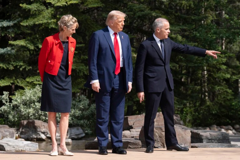 US President Donald Trump is greeted by Diana Fox Carney and the Prime Minister of Canada Mark Carney, right, at the G7 summit in Kananaskis, Alberta, Canada, Monday June 16, 2025. (Stefan Rousseau/Pool Photo via AP)