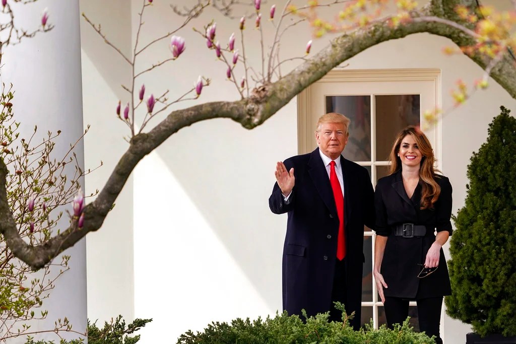 President Donald Trump waves with outgoing White House Communications Director Hope Hicks before boarding Marine One on the South Lawn of the White House in Washington, Thursday, March 29, 2018, for a short trip to Andrews Air Force Base, Md., and then on to Cleveland. (AP Photo/Andrew Harnik)