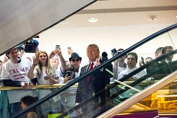 FILE - Business mogul Donald Trump rides an escalator to a press event to announce his candidacy for the U.S. presidency at Trump Tower on June 16, 2015 in New York City. Trump is the 12th Republican who has announced running for the White House.