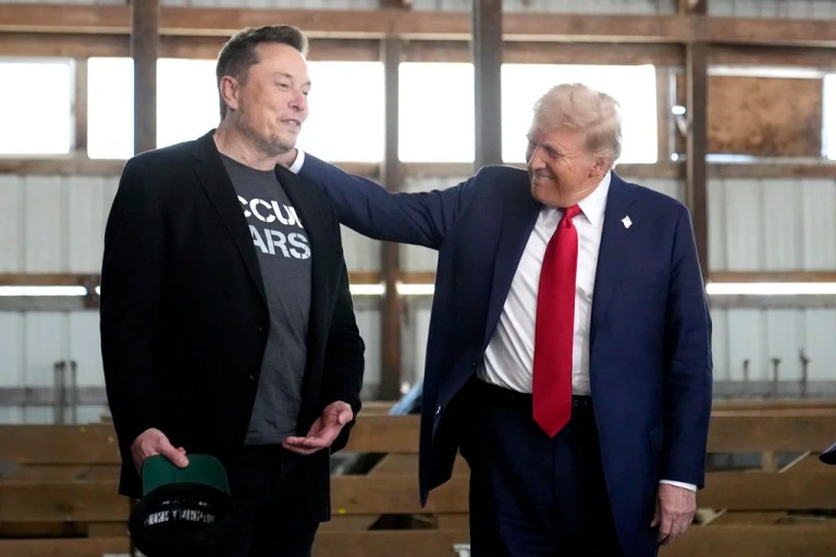 President-elect Donald Trump listens to Elon Musk as he arrives to watch SpaceX's mega rocket Starship lift off for a test flight from Starbase in Boca Chica, Texas, Tuesday, Nov. 19, 2024. (Brandon Bell/Pool via AP)