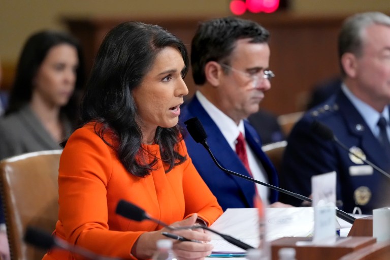 Director of National Intelligence Tulsi Gabbard, left, joined by CIA Director John Ratcliffe, testifies as the House Intelligence Committee holds a hearing on worldwide threats, at the Capitol, in Washington, March 26, 2025.