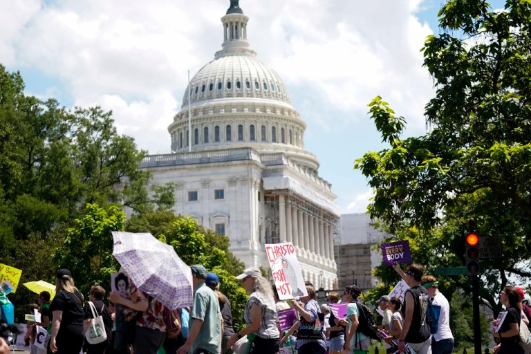 Demonstrators hold signs as they walk past the U.S. Capitol building during the Women's March in Washington, Saturday, June 24, 2023. Abortion rights and anti-abortion activists held rallies Saturday in Washington and across the country to call attention to the Dobbs v. Jackson Women's Health Organization ruling on June 24, 2022, which upended the 1973 Roe v. Wade decision.