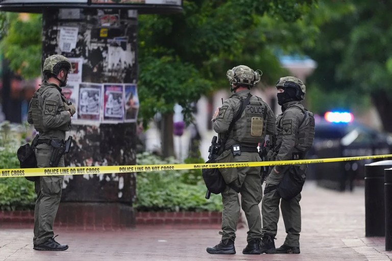 Law enforcement officials investigate after an attack on the Pearl Street Mall, Sunday, June 1, 2025, in Boulder, Colo.