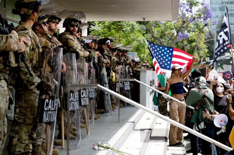 Protesters stand off against California National Guard soldiers at the Federal Building in downtown Los Angeles during a 