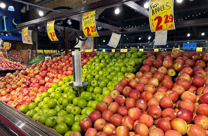 Apples prices are displayed at a grocery store in Wheeling, Ill.,