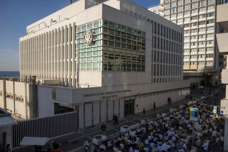 Activists sit in front of the U.S. Embassy branch office in Tel Aviv, Israel, during a protest, Wednesday, Jan. 8, 2025.
