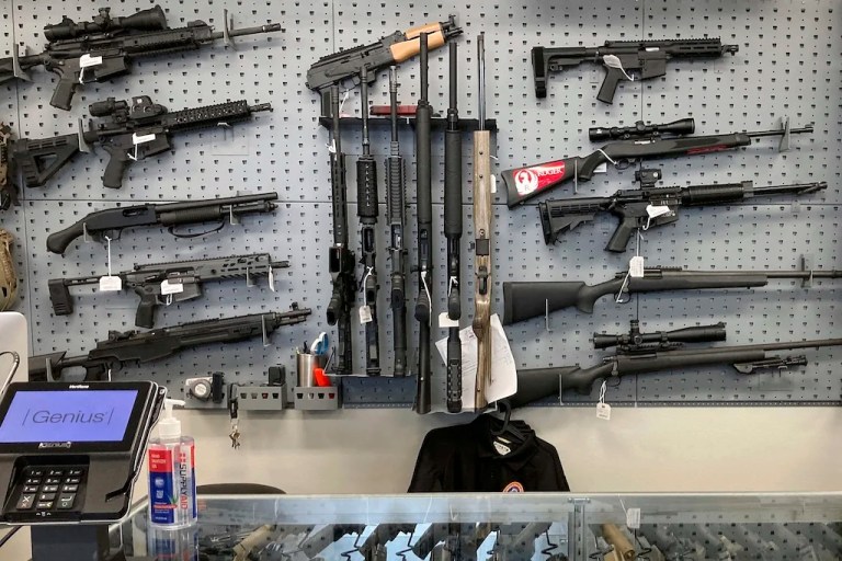FILE - Firearms are displayed at a gun shop, Feb. 19, 2021, in Salem, Ore. (AP Photo/Andrew Selsky, File)