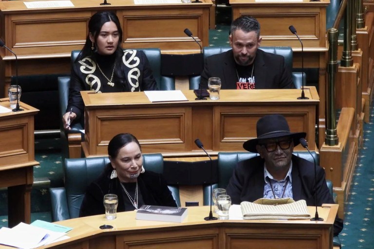 New Zealand lawmakers Hana-Rāwhiti Maipi-Clarke, top left, Debbie Ngarewa-Packer, bottom left, and Rawiri Waititi, bottom right, watch as other legislators debate their proposed bans in parliament in Wellington on Thursday, June 5, 2025.