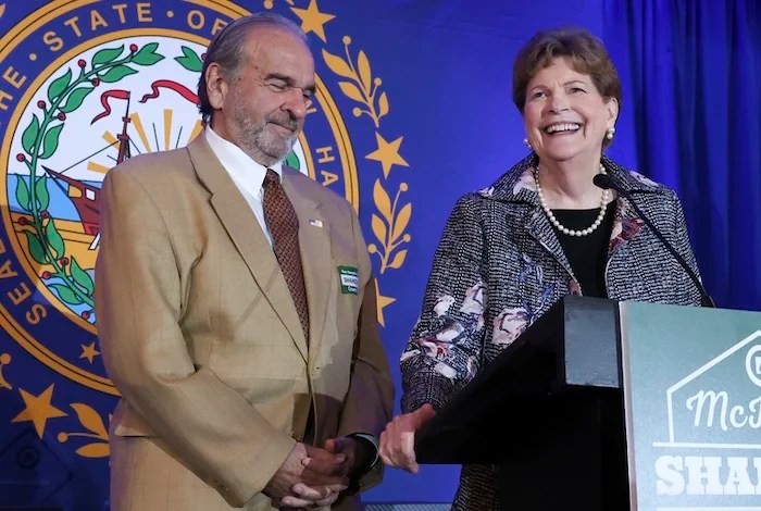 Sen. Jeanne Shaheen (D-NH) speaks as her husband Bill looks on during the McIntyre-Shaheen 100 Club Dinner, Sunday April 27, 2025, in Manchester, New Hampshire.