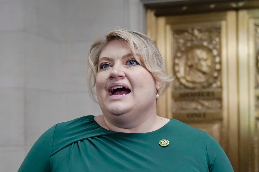 Rep. Kat Cammack, R-Fla., talks with reporters as Republicans hold a caucus meeting at the Capitol in Washington, Friday, Oct. 13, 2023.