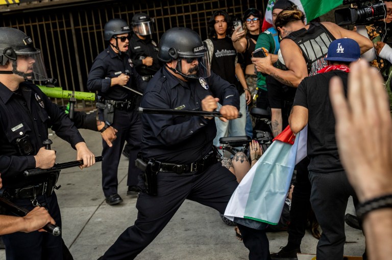 People line up to arrest kettled protesters during protests over federal immigration enforcement raids on Wednesday, June 11, 2025, in down town Los Angeles.