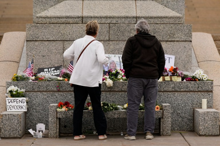 Dianne, left, and Rick (last names withheld) visit makeshift memorial for Minnesota state Rep. Melissa Hortman and her husband Mark at the state Capitol, Sunday, June 15, 2025, in St. Paul, Minn. (AP Photo/George Walker IV)