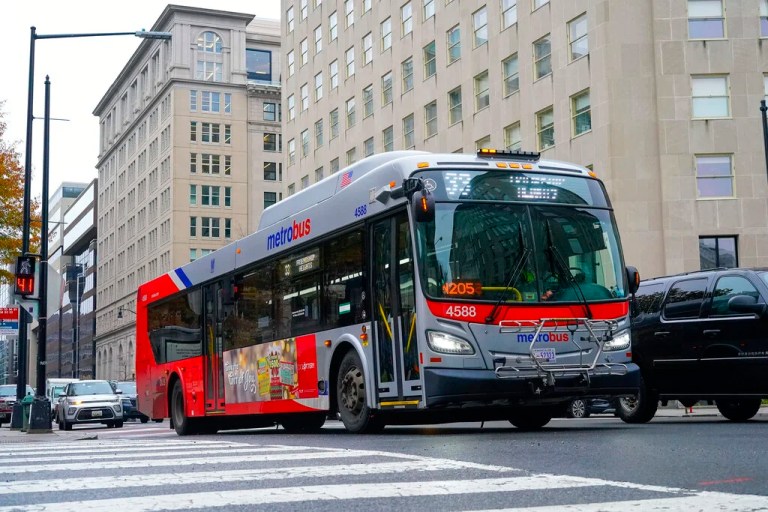 A Metrobus in downtown Washington, Wednesday, Dec. 7, 2022. The Washington DC government voted to waive fares for Metrobus rides within city limits starting July, 1, 2023, becoming the nation's most populous city to offer free public transit. (AP Photo/Pablo Martinez Monsivais)
